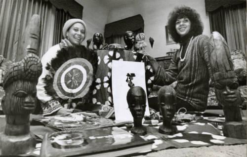 Schyleen Qualls and Cleo Parker Robinson in 1977 display some of the crafts they brought back from Nigeria.