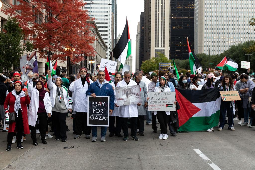 Medical staff join protesters during a Free Palestine march in Chicago on Oct. 21.