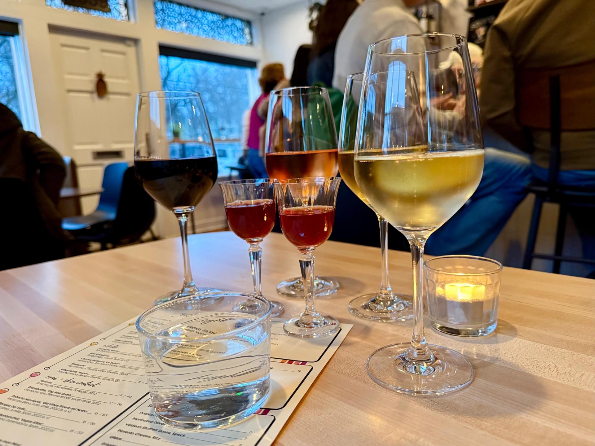 5 different types of wine sitting on a table at Solera in Bloomfield