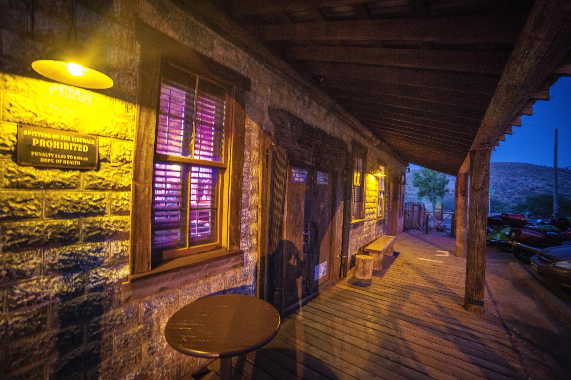 The front porch of the Pioneer Saloon at dusk.