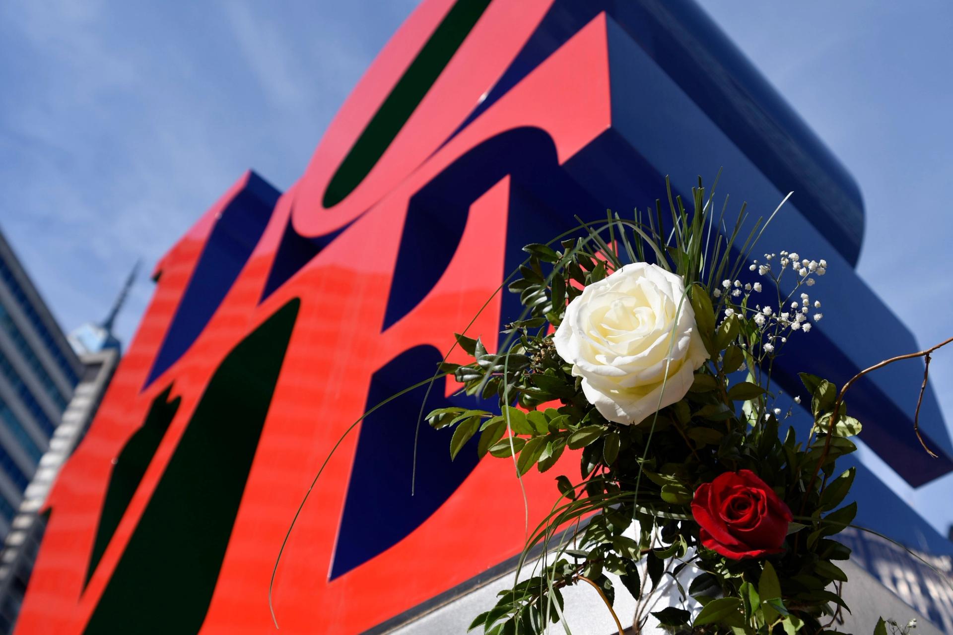Robert Indiana's LOVE sculpture with roses on Valentine's Day.
