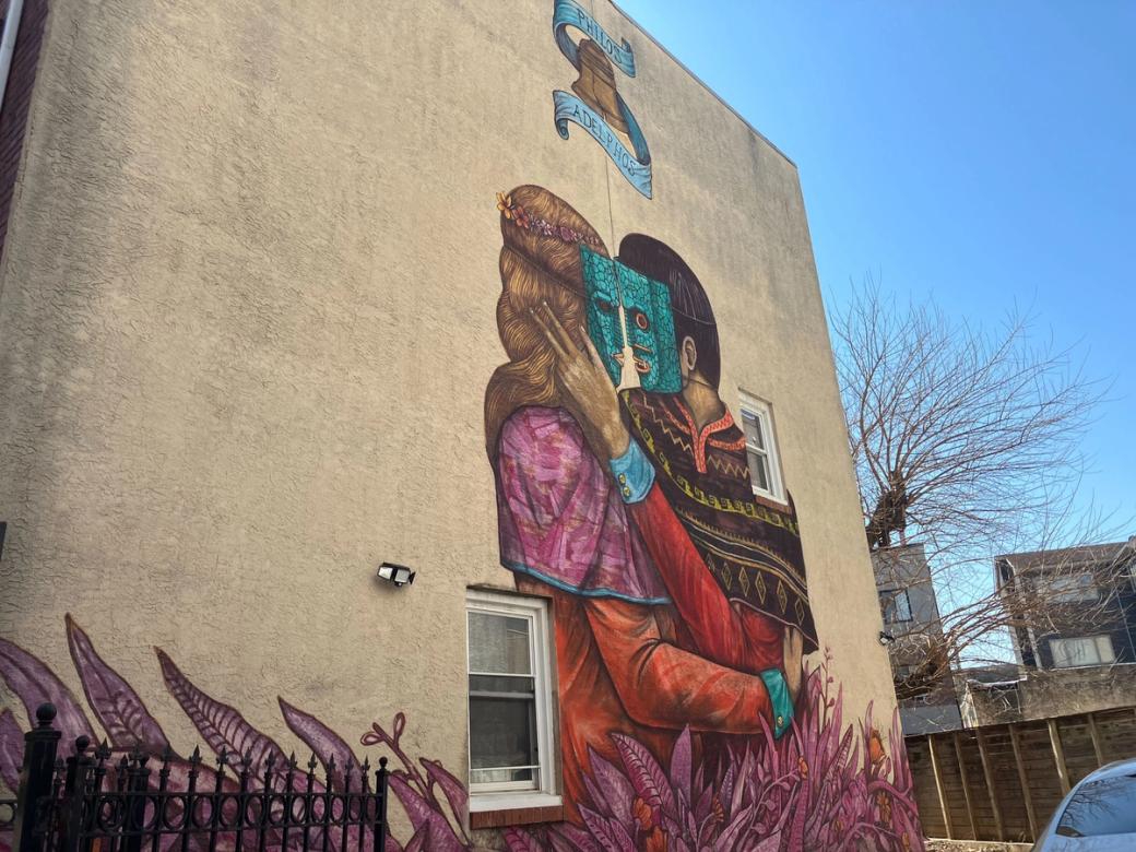 Mural of a masked couple