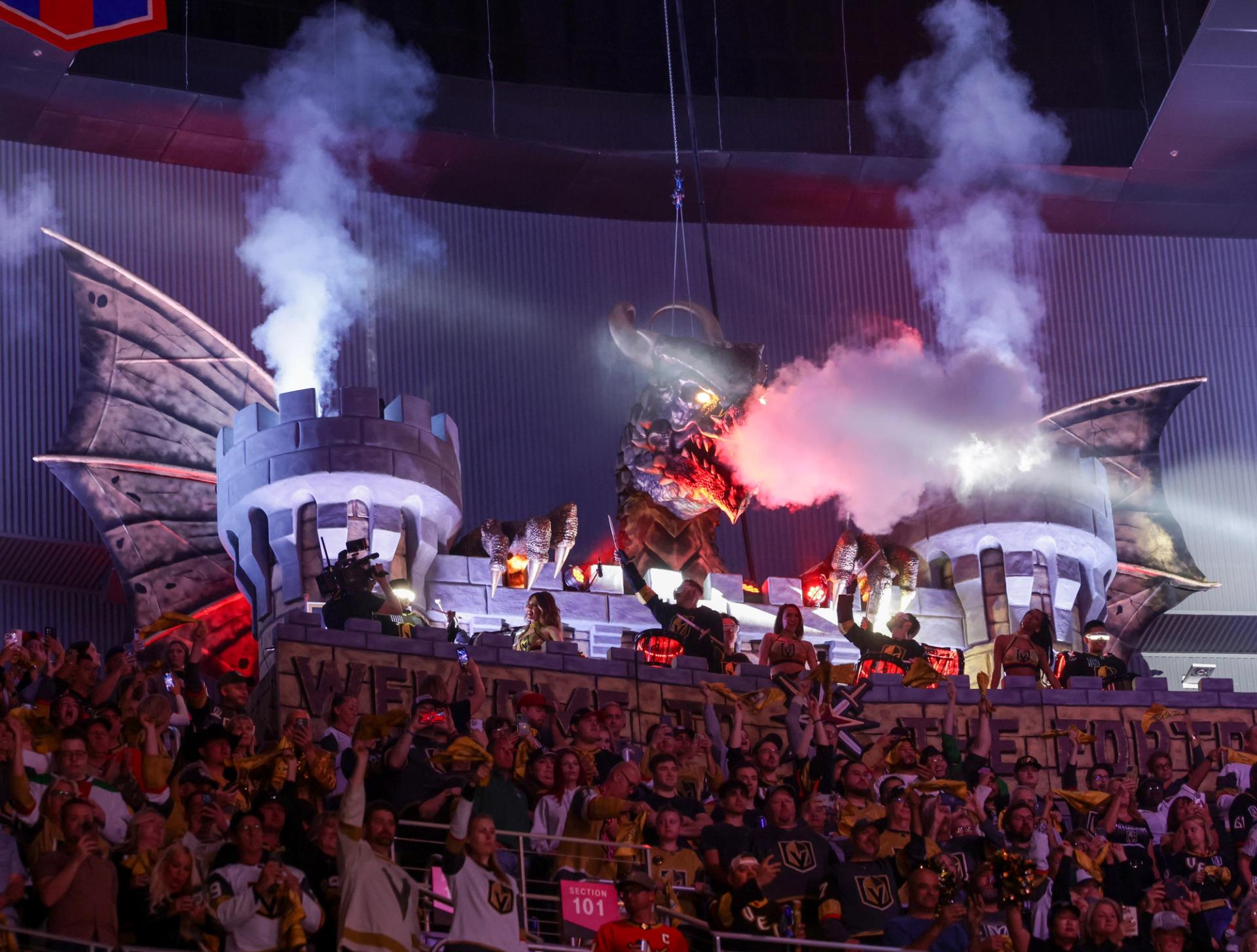 A mechanical dragon breathes fire at a Vegas Golden Knights game.