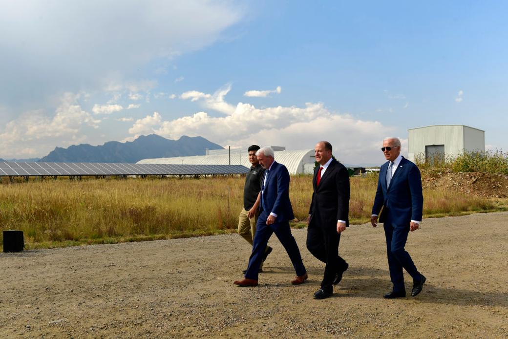Men walk around Colorado in suits
