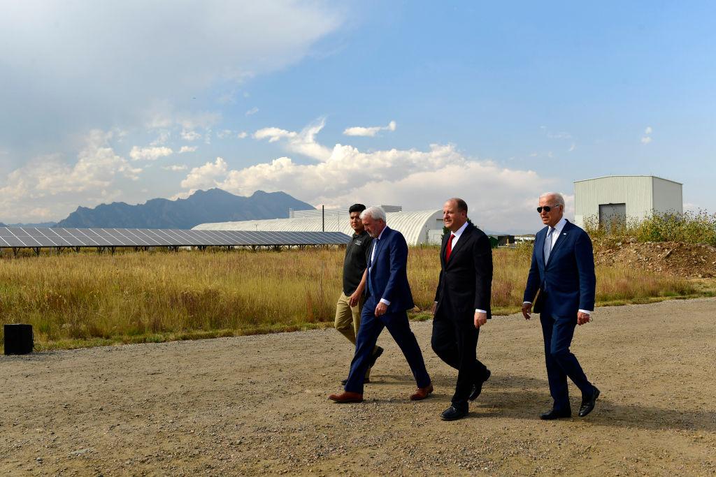 Men walk around Colorado in suits