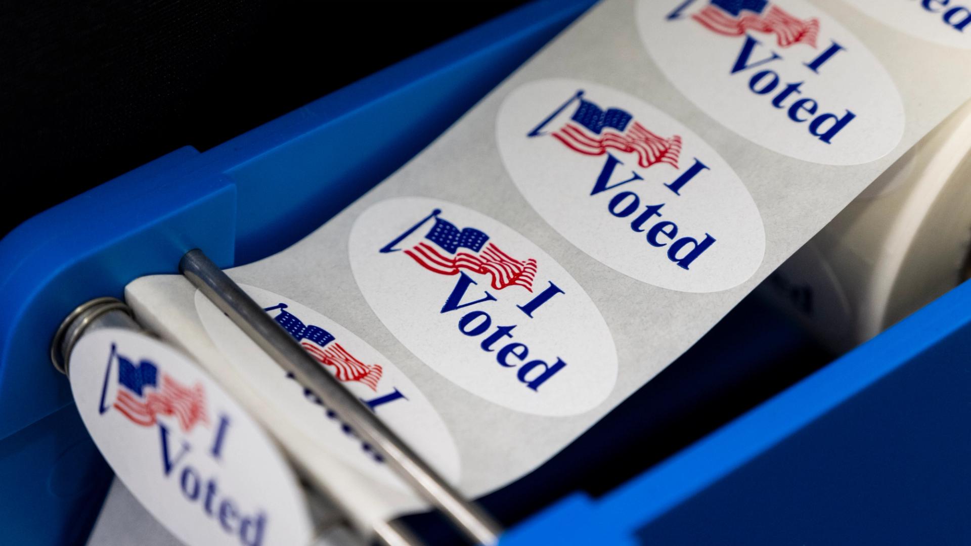 A roll of white oval stickers that say "I voted" with an American flag.