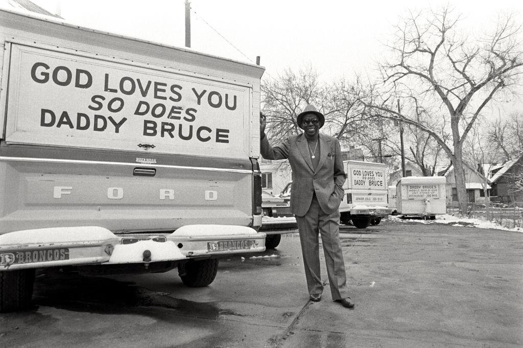 “Daddy Bruce” Randolph, restaurateur and philanthropist, stands next to a delivery truck in 1985.