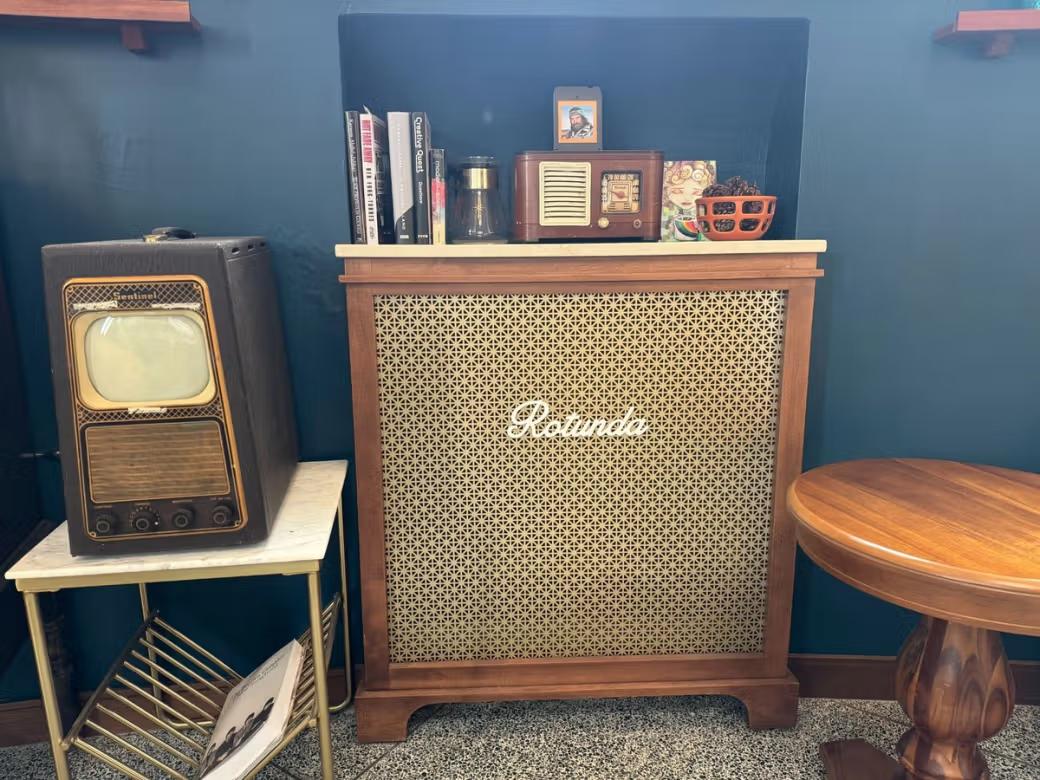 A collection TVs and speakers. One reads "Rotunda"