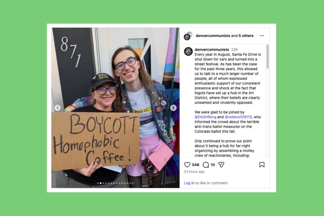 Two people stand at a protest 