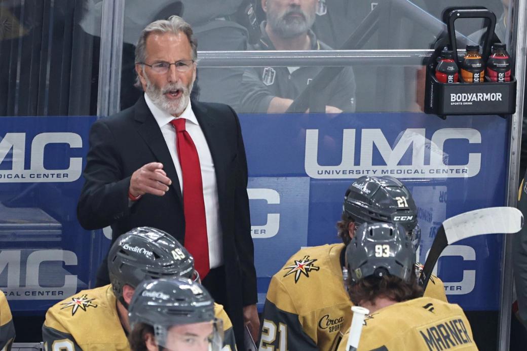 Vegas Golden Knights coach John Tortorella pointing at players on the ice.