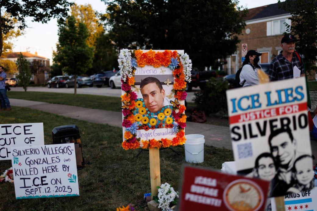 Signs posted up in a grassy a few of which show a man, Silverio Villegas González, along with other victims of ICE. Other signs are calling for ICE to get out of Chicago