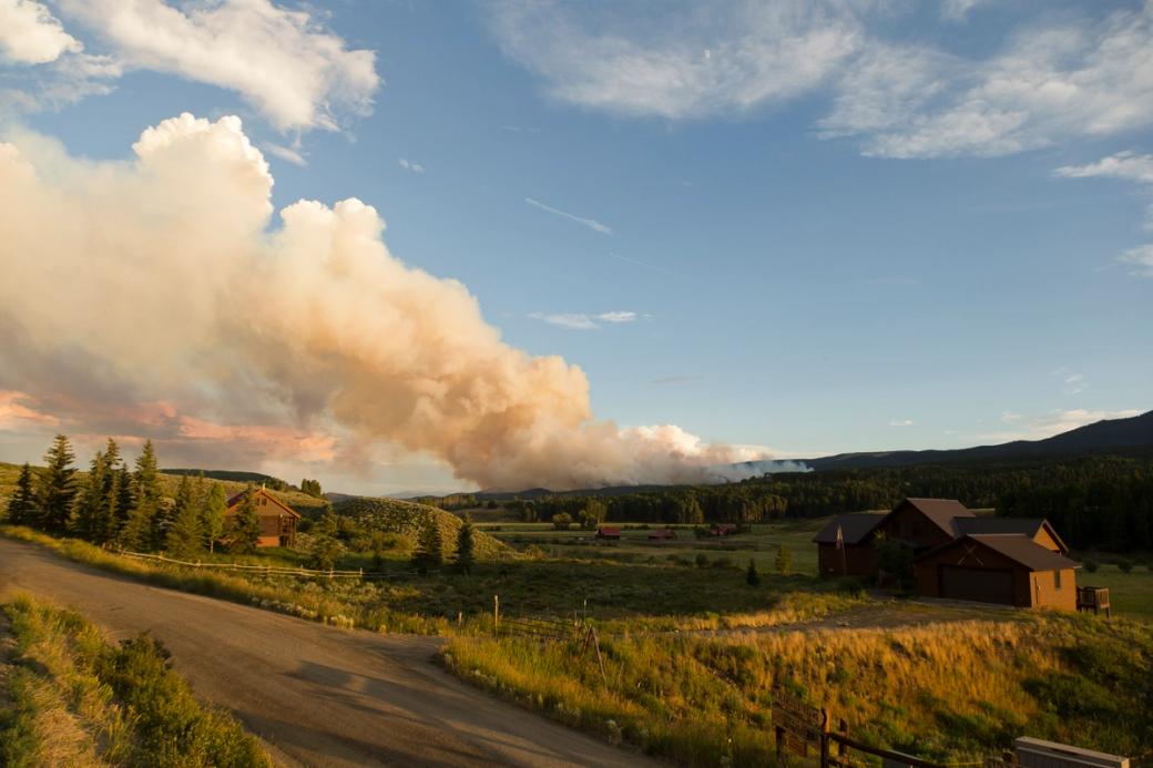 Smoke billows from a mountain during a Colorado wildfire.