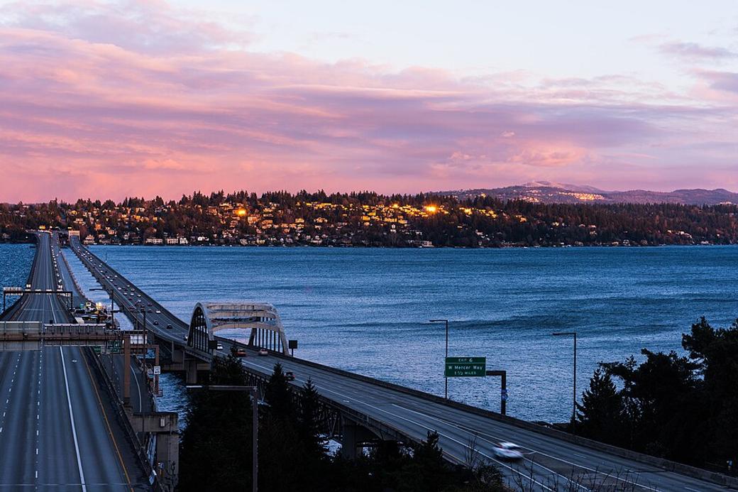 An image of the 1-90 floating bridge at dusk