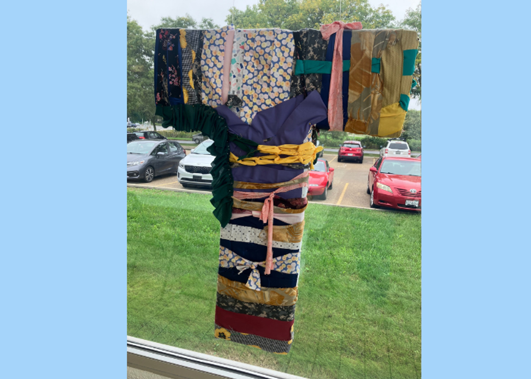 A T-shaped installation made of t-shirts.