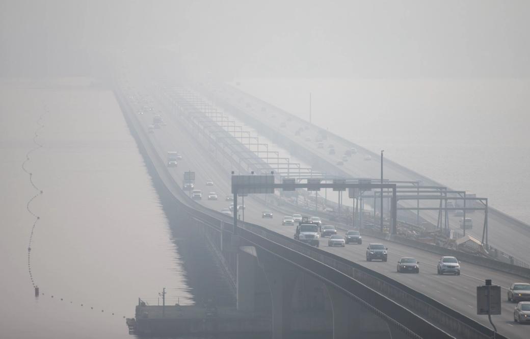 The I-90 Bridge with cars in the distance engulfed by smoke