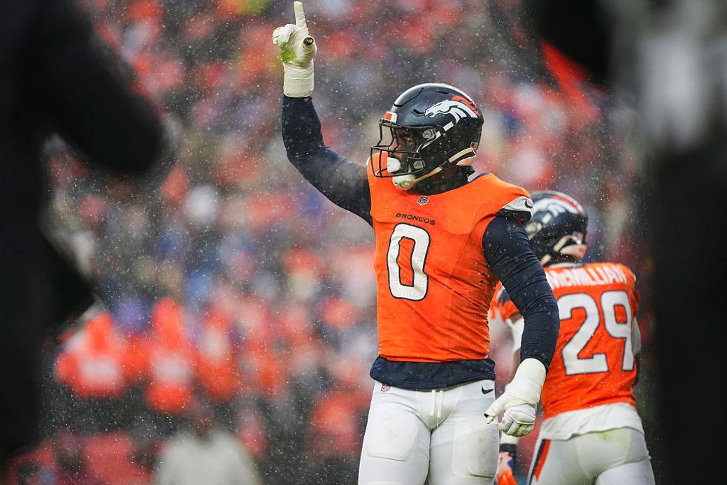 Denver Broncos player Jonathon Cooper plays in a football game.