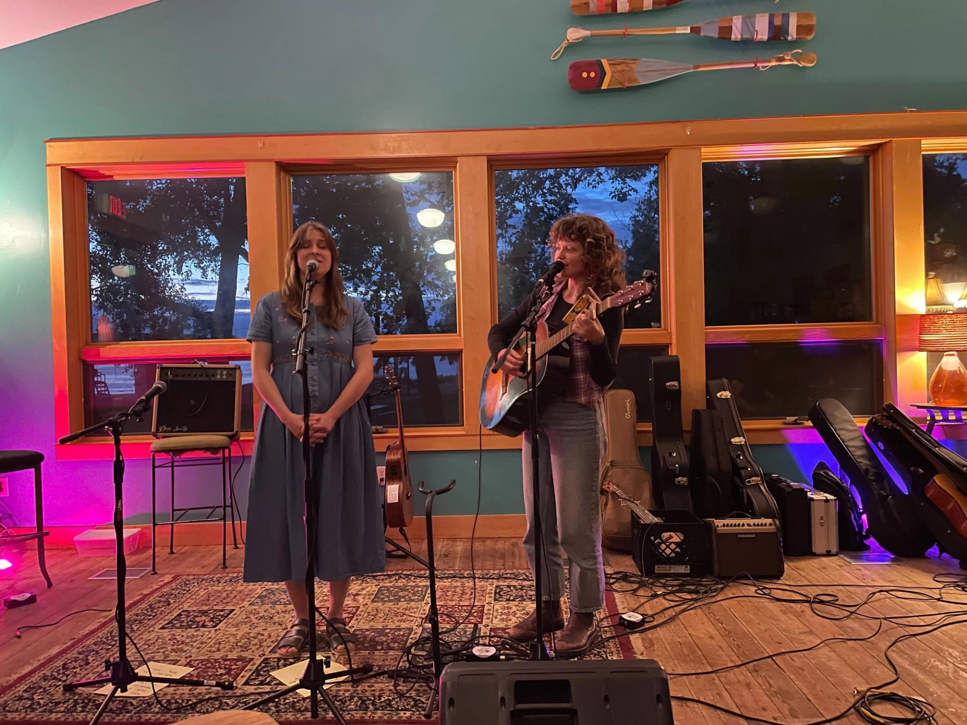 Two people perform live music in Lakeside Street Coffee House.