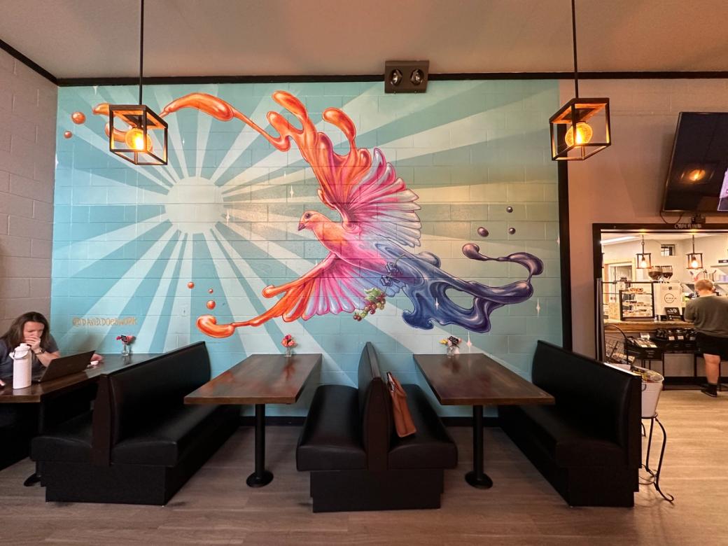 A colorful wall mural painted inside Denver's FREE Café in the University neighborhood