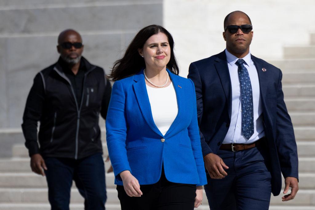 Colorado Secretary of State Jena Griswold wearing blue walking at public appearance