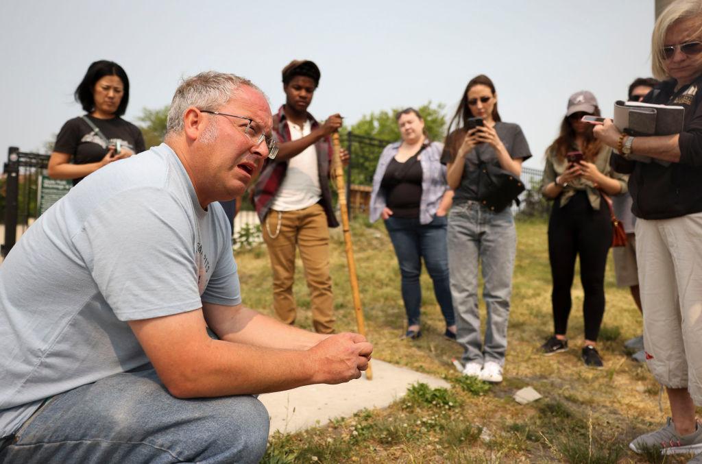 Professional forager Dave Odd leads an Eat the Park foraging event near Montrose Beach in 2023.