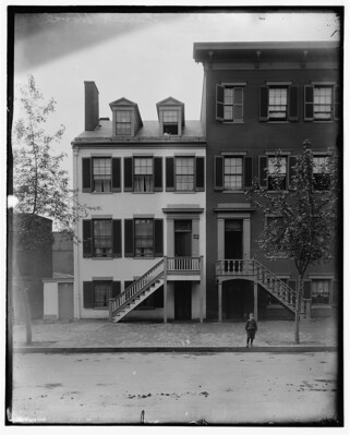 (Left) Mrs. Mary Surratt house at 604 H St. NW Washington, DC between 1890 and 1910. (Brady-Handy Photograph Collection/Library of Congress) (Right) Wok and Roll restaurant in the old boarding house, 2017. ( Difference engine/Wikimedia Commons)