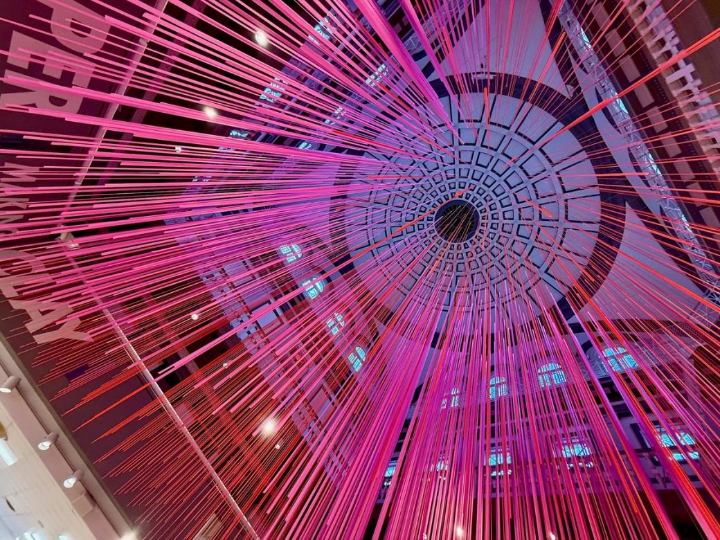 pink art installation hanging from ceiling