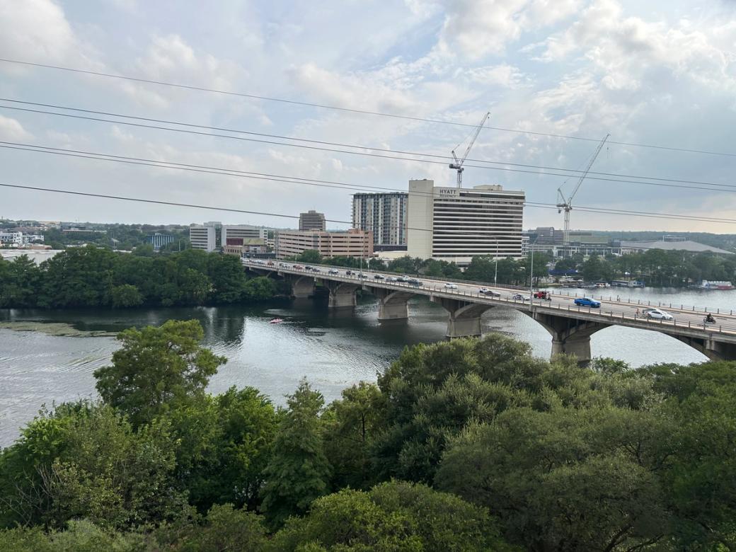 A lake with an overpass over it.