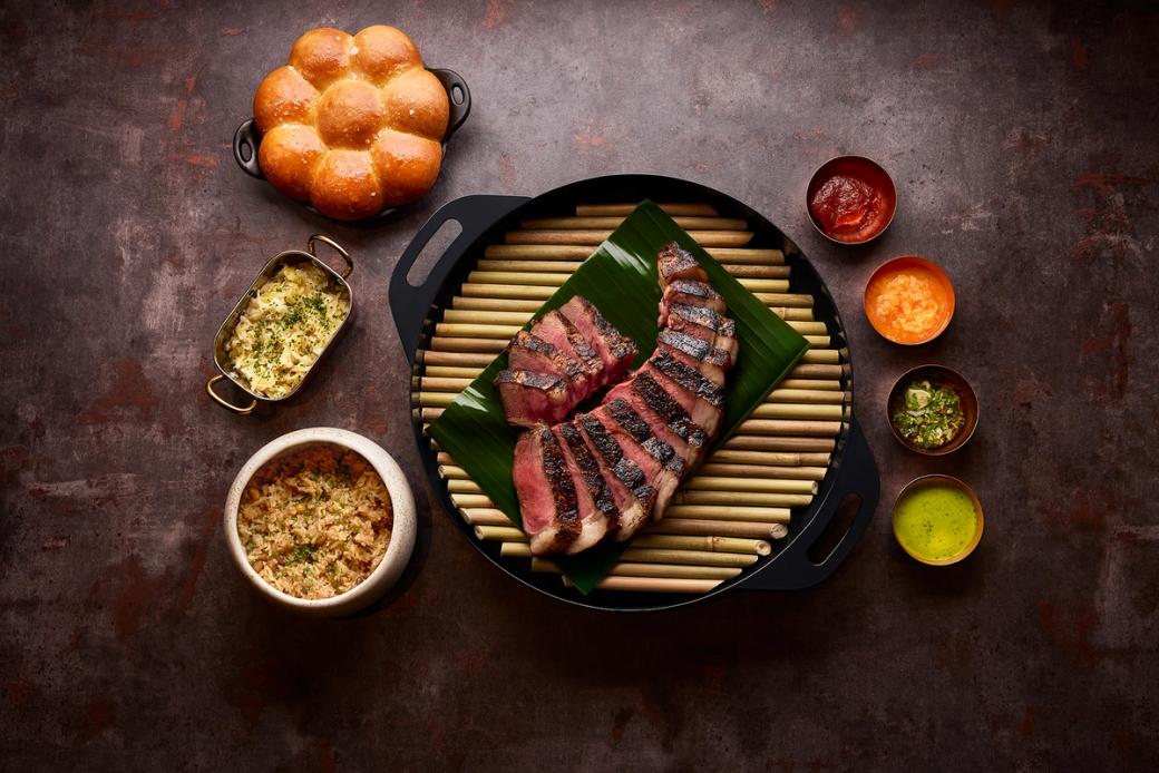 Rare steak on a hibachi.