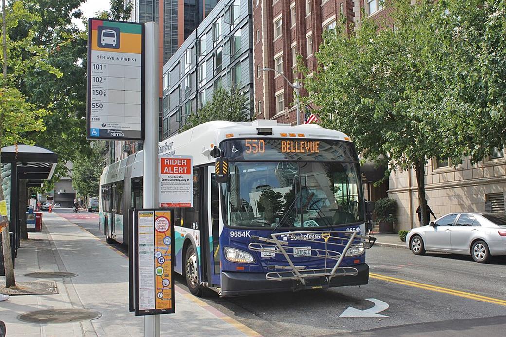 An image of a 550 bus at a bus stop