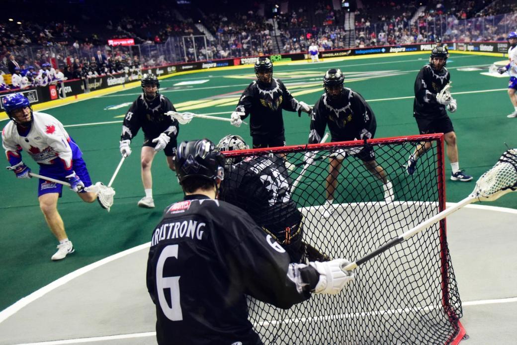 Lacrosse players play against each other