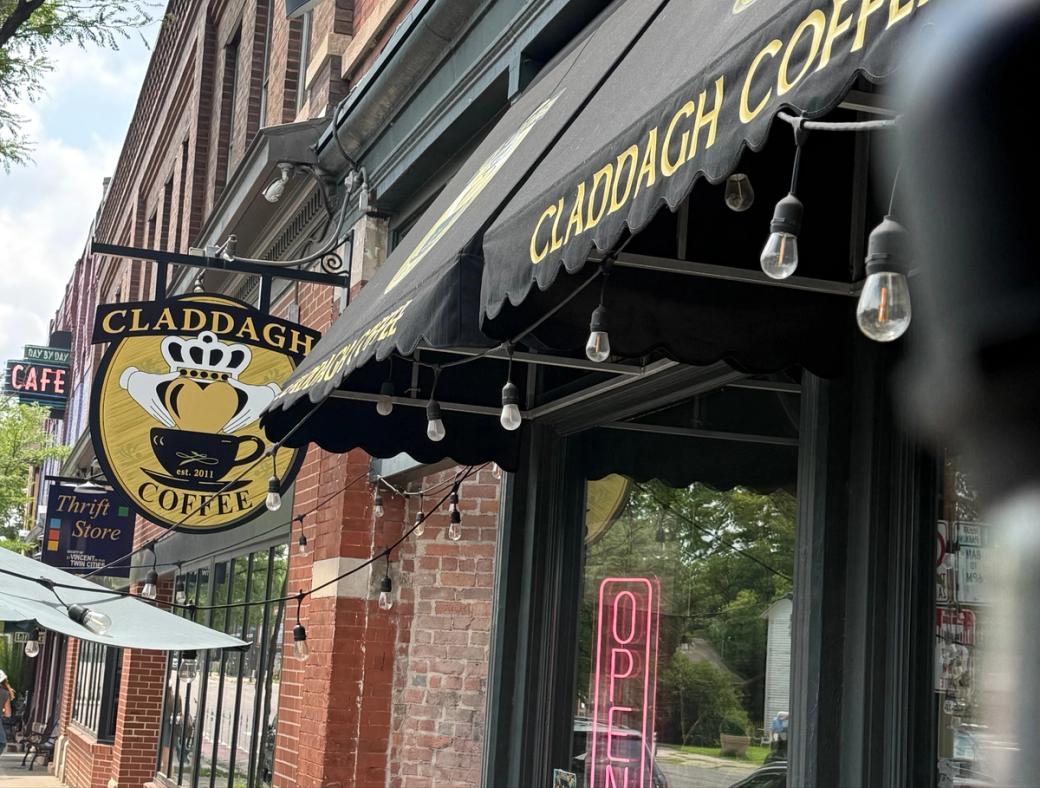 Line of businesses, with "Claddagh Coffee" sign in foreground
