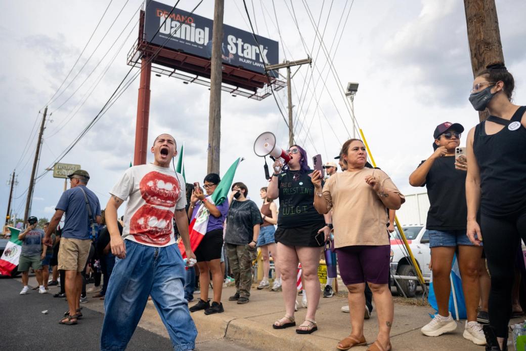 Protesters on an Austin sidewalk.
