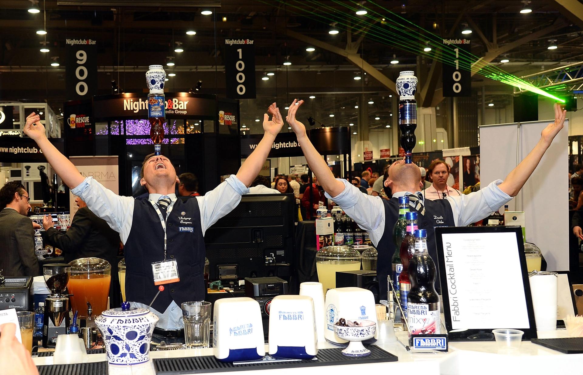 Flair bartenders demonstrate a trick at the Las Vegas Convention Center.