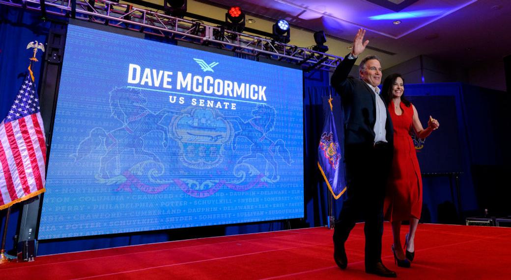 Dave McCormick celebrates on stage