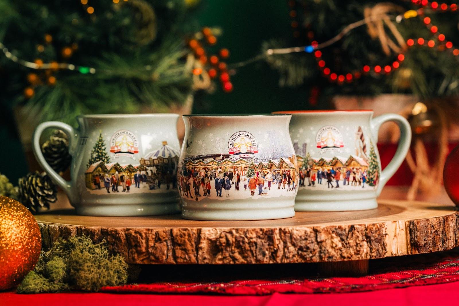 Three 2023 Christkindlmarket location-specific mugs