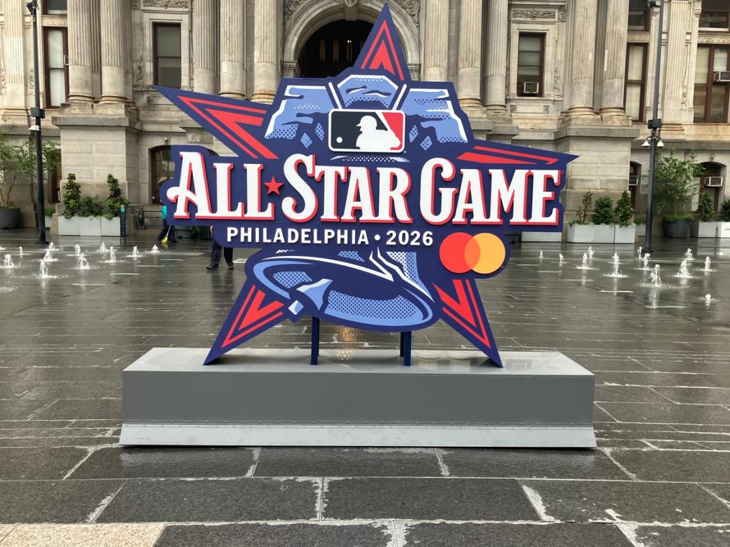Display of MLB All-Star Game logo of a liberty bell overlaid on a red star in front of Philadelphia's city hall
