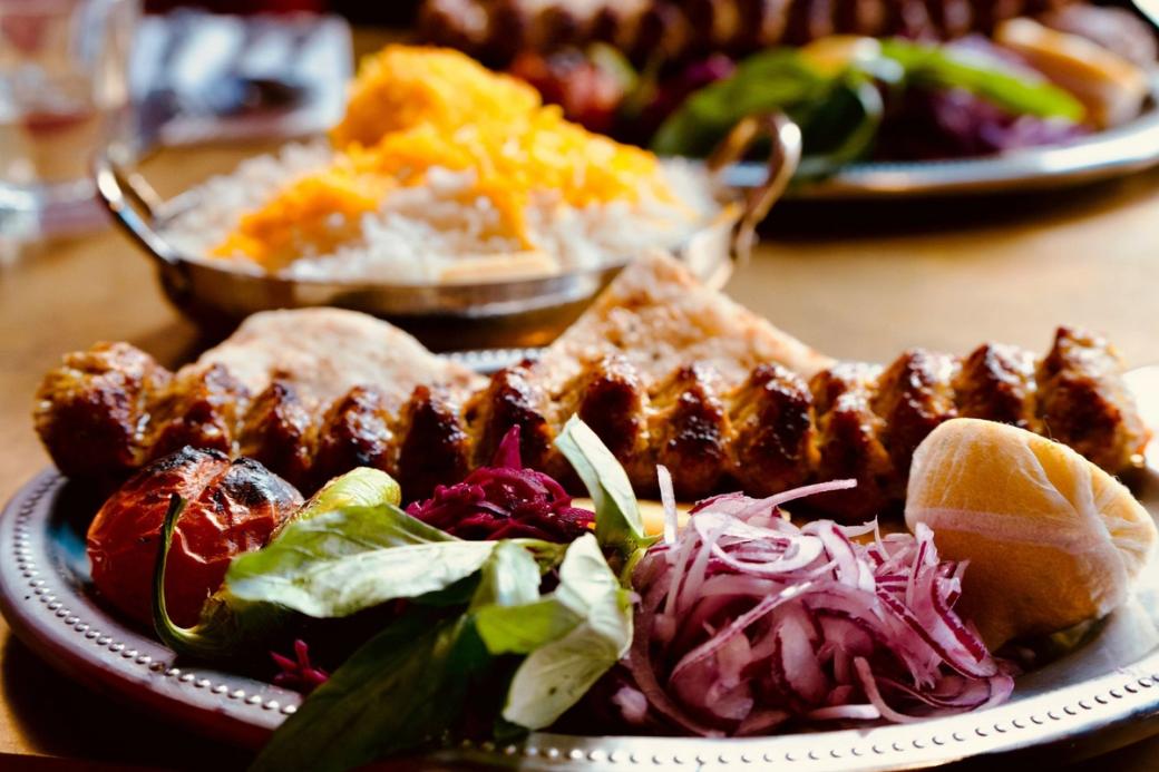 A plate of meat and vegetables.