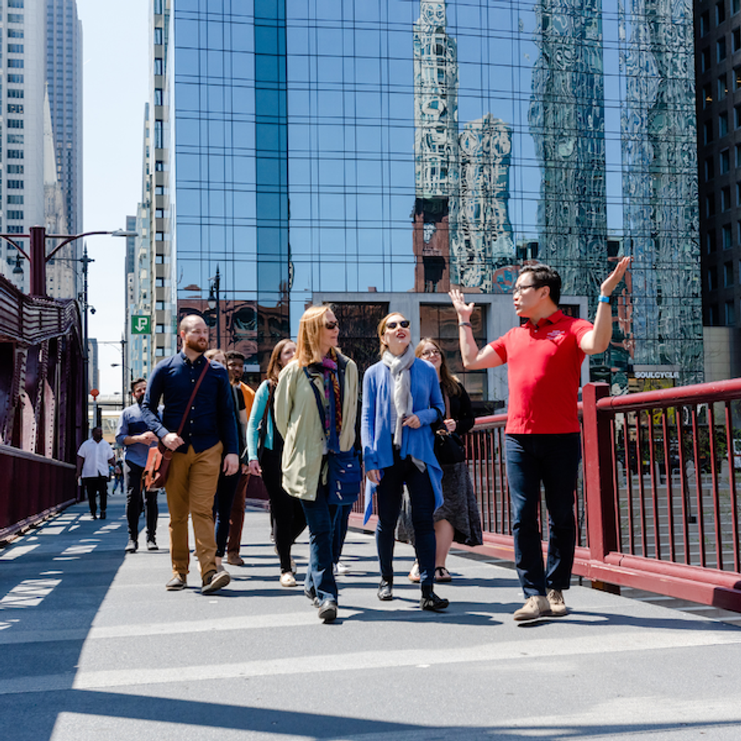 Display Ad: Gentleman leading a walking tour in a city 