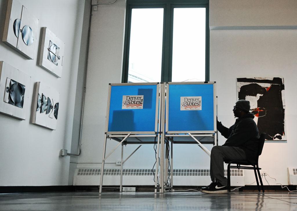 A Denver resident casts their vote in the 2024 election