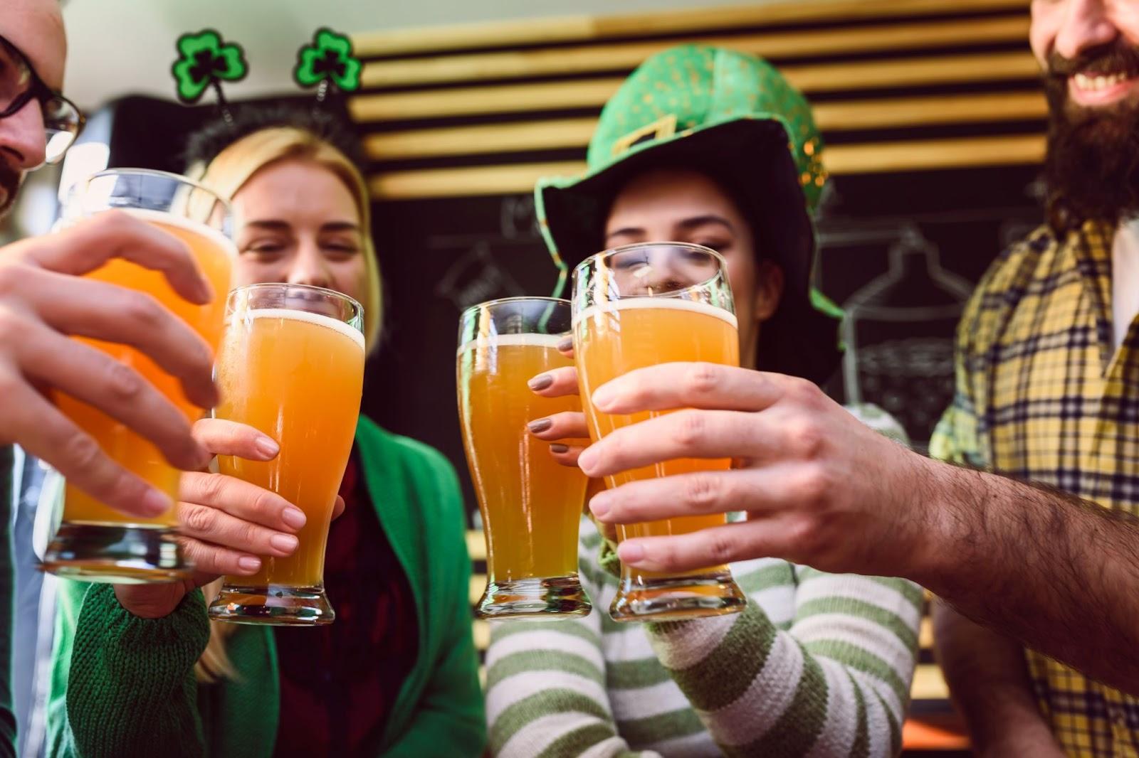 St. Patrick's Day celebrants cheers with beer