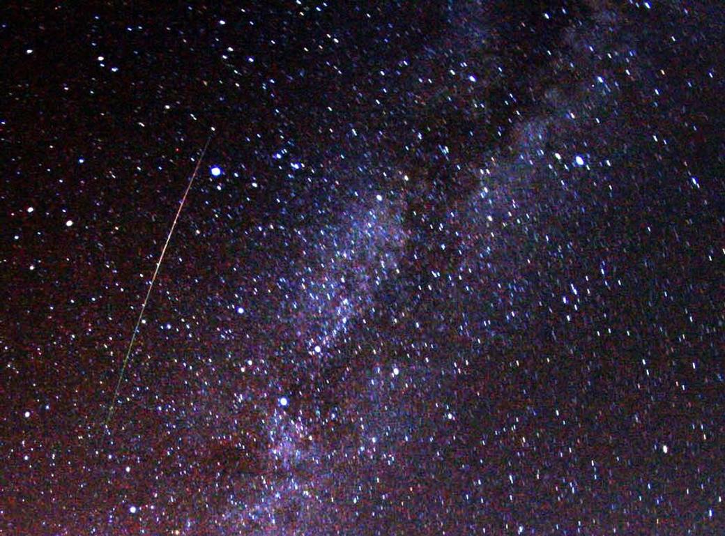 An image of the Milky Way with a Perseid meteor cutting right through the sky