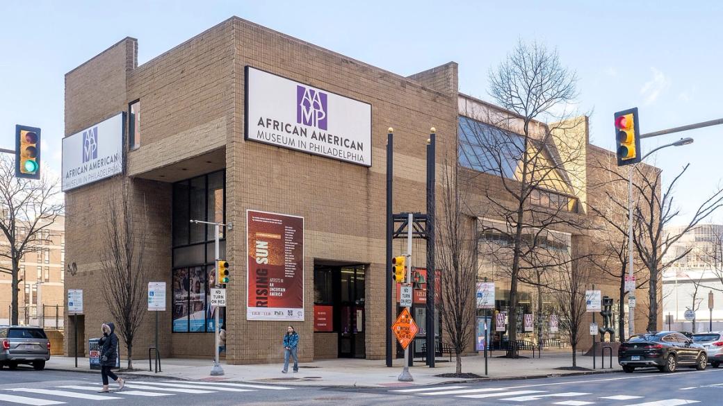 Exterior of the African American Museum of Philadelphia, a boxy brown building on a street corner