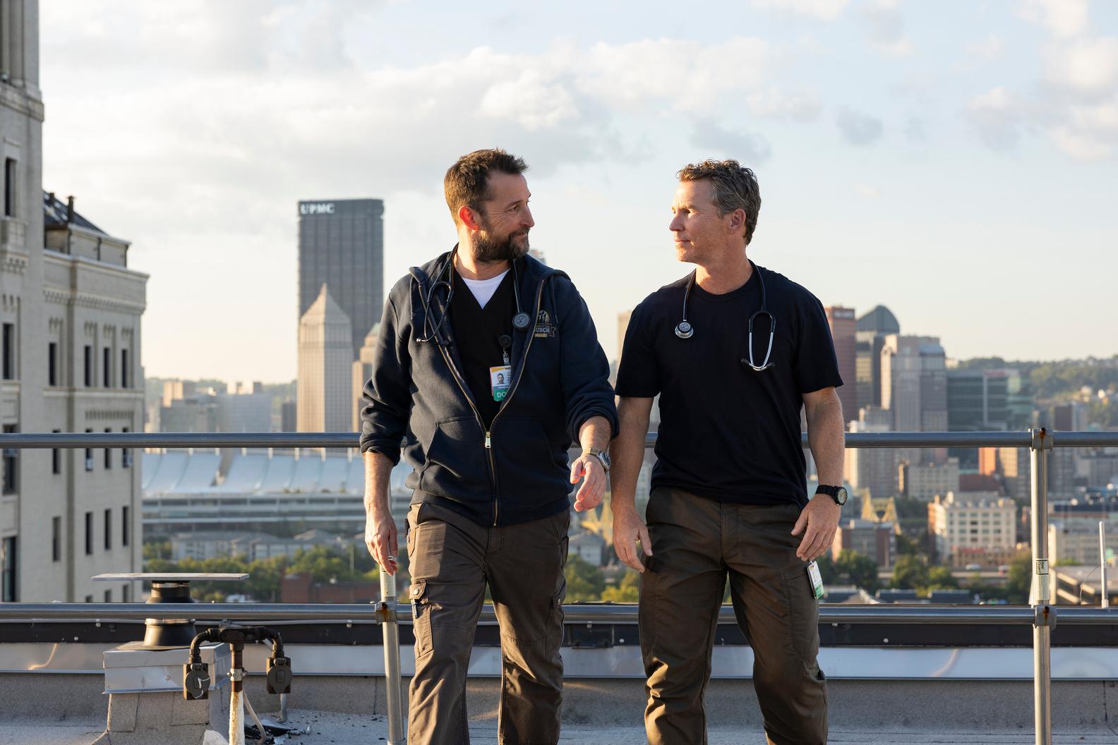 Dr. Robby and Dr. Abbott on top of Allegheny General Hospital’s Snyder Pavilion with the Downtown skyline in the background