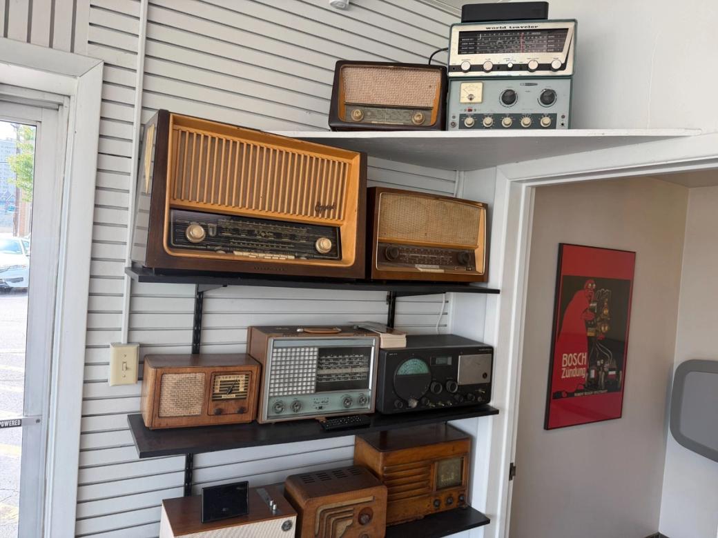 Shelves with vintage radios.