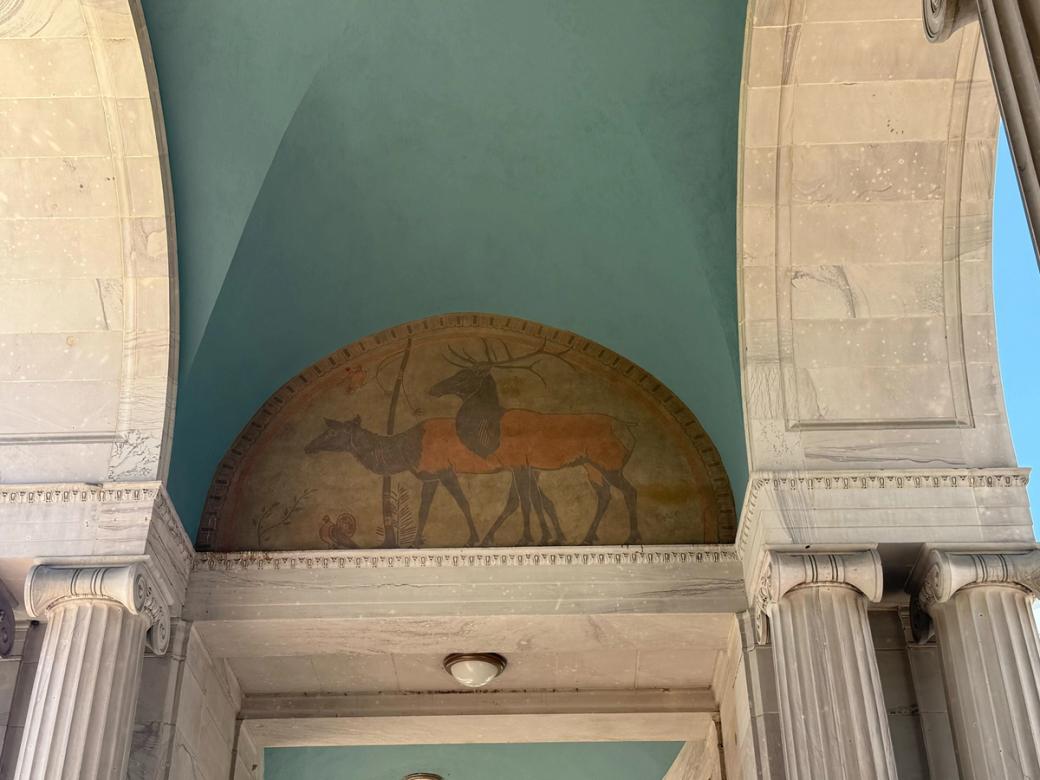 A mural on the ceiling of Civic Center Park’s Greek Amphitheatre arch.