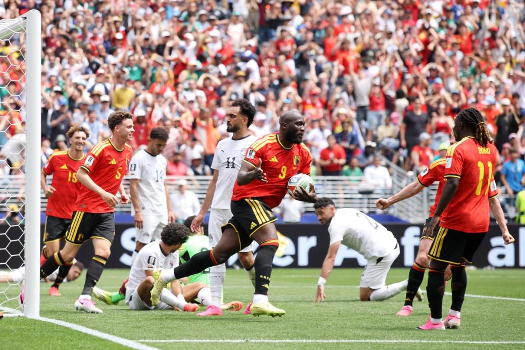 An image of the Belgium team celebrating in front of Egypt’s goal