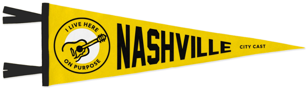 A yellow pennant flag with a guitar icon on the left. Text reads: I live here on purpose. Nashville City Cast.
