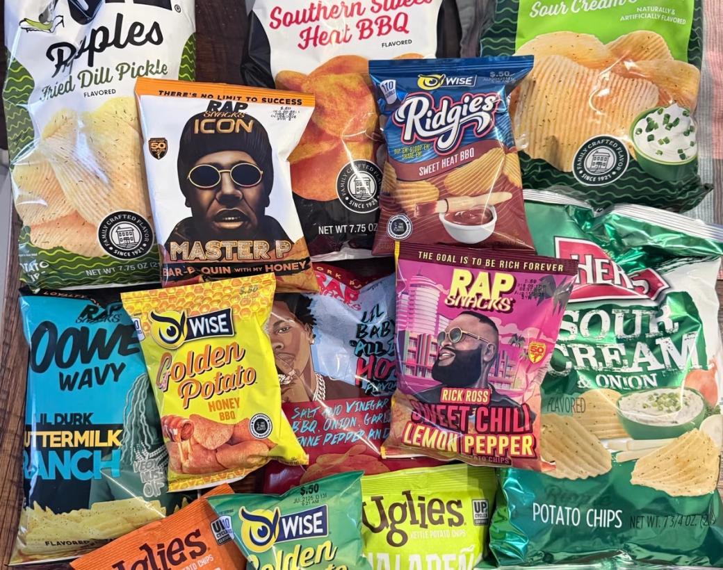 A collection of potato chip brand bags such as Rap Snacks, Wise, Uglies, and Herr's