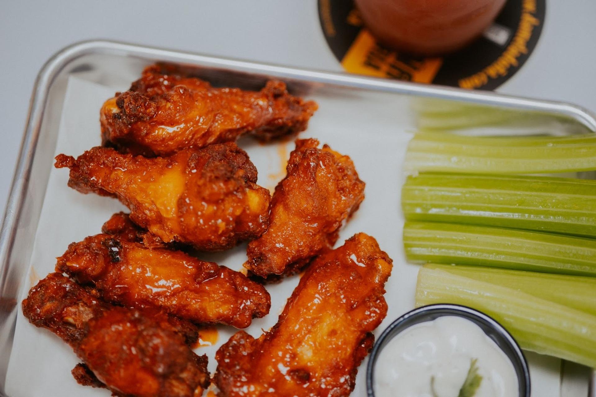 Wings on a tray with celery and ranch