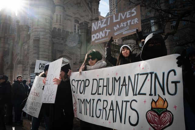 Activists protest the agenda of President Donald Trump on the Magnificent Mile Saturday.